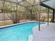 Inviting screened-in pool with tranquil blue water and cozy outdoor space at 7879 Camlyn Ct, Orlando, FL 32818