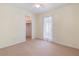 Bright bedroom with carpet, ceiling fan, and closet access at 826 W Gaucho Cir, Deltona, FL 32725