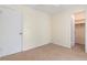 Bedroom featuring neutral colored walls and carpet, closet and base molding at 826 W Gaucho Cir, Deltona, FL 32725