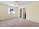Bedroom with carpet floors, ceiling fan and natural light at 826 W Gaucho Cir, Deltona, FL 32725