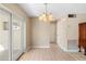 Dining area features tile flooring and a classic chandelier at 826 W Gaucho Cir, Deltona, FL 32725