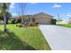 Charming single-story home featuring a well-manicured lawn and a spacious two-car garage at 826 W Gaucho Cir, Deltona, FL 32725