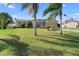 Charming single-story home with mature landscaping and a well-manicured lawn at 826 W Gaucho Cir, Deltona, FL 32725
