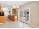Kitchen with wood cabinets provides sliding door access to a beautiful pool at 826 W Gaucho Cir, Deltona, FL 32725