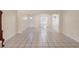 Neutral living room features tile flooring and ample natural light at 826 W Gaucho Cir, Deltona, FL 32725