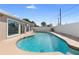 Sparkling in-ground pool with a tiled border and a white privacy fence at 826 W Gaucho Cir, Deltona, FL 32725
