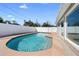 Beautiful in-ground pool with a surrounding patio and a white privacy fence at 826 W Gaucho Cir, Deltona, FL 32725