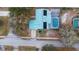 Aerial view of home with solar panels and screened pool in a residential neighborhood at 980 Buttercup Ter, Deltona, FL 32725