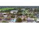 Aerial view of house showing screened pool, solar panels and neighborhood at 980 Buttercup Ter, Deltona, FL 32725