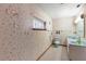 Charming bathroom with blue fixtures and butterfly wallpaper at 980 Buttercup Ter, Deltona, FL 32725