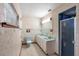 Charming bathroom with blue fixtures and butterfly wallpaper at 980 Buttercup Ter, Deltona, FL 32725