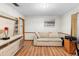 Bedroom features hardwood floors, base molding, and neutral paint at 980 Buttercup Ter, Deltona, FL 32725