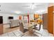 Open concept dining area connects kitchen and living room for easy access at 980 Buttercup Ter, Deltona, FL 32725