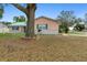 This cozy home features a well-manicured front lawn and vibrant landscaping at 980 Buttercup Ter, Deltona, FL 32725
