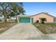 Inviting home with a well-kept lawn, spacious driveway, and a two car garage at 980 Buttercup Ter, Deltona, FL 32725