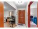Inviting hallway with front door and open access to living room and office spaces at 980 Buttercup Ter, Deltona, FL 32725