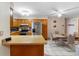 This spacious kitchen offers stainless steel appliances and a connected dining area at 980 Buttercup Ter, Deltona, FL 32725
