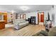 Open-concept living room features hardwood floors and natural light at 980 Buttercup Ter, Deltona, FL 32725