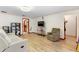 Comfortable living room features hardwood floors, a ceiling fan, and a tv at 980 Buttercup Ter, Deltona, FL 32725