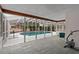 Enclosed pool area features a light blue interior, plenty of space and access to an exercise area at 980 Buttercup Ter, Deltona, FL 32725