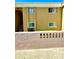 Tan condo building featuring multiple windows and concrete perimeter wall at 1000 Lake Of The Woods Blvd # 104F, Casselberry, FL 32730