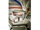 Image shows the property's compact and efficient on-demand water heater system at 1000 Lake Of The Woods Blvd # 104F, Casselberry, FL 32730