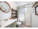 Clean bathroom featuring updated finishes and a glass door shower at 10477 Montpelier Cir, Orlando, FL 32821