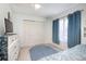 Bedroom featuring light walls, a ceiling fan, and tile flooring at 10477 Montpelier Cir, Orlando, FL 32821