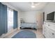 Bedroom with blue accents, a ceiling fan, and tile flooring at 10477 Montpelier Cir, Orlando, FL 32821