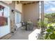 Inviting front porch with a cozy seating area, decorative plants, and a welcoming entrance with house number visible at 10477 Montpelier Cir, Orlando, FL 32821