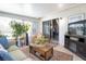 Comfortable sunroom featuring a cozy seating area, indoor plants, and sliding glass doors at 10477 Montpelier Cir, Orlando, FL 32821