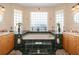 Elegant bathroom with a large soaking tub, dual vanities, and decorative tile work at 1051 Dunbar Ave, Sanford, FL 32771
