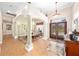 Welcoming foyer featuring tile floors, arched doorways, and a view of the dining area at 1051 Dunbar Ave, Sanford, FL 32771