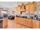 Traditional kitchen with wood cabinets, granite countertops, stainless steel appliances, and an eat-in area at 1051 Dunbar Ave, Sanford, FL 32771