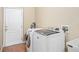 Convenient laundry room with tile flooring and modern washer and dryer at 1051 Dunbar Ave, Sanford, FL 32771