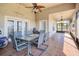 Spacious tiled patio with ceiling fans and outdoor seating area at 1051 Dunbar Ave, Sanford, FL 32771