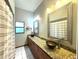 Spacious bathroom featuring bowl sinks, granite countertops, and ample cabinet storage at 1226 Deer Lake Cir, Apopka, FL 32712