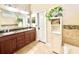 Bathroom featuring double vanity with granite countertop and ample cabinet storage at 1226 Deer Lake Cir, Apopka, FL 32712