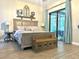 Bedroom showcases a king-sized bed and a door to the outdoor patio at 1226 Deer Lake Cir, Apopka, FL 32712