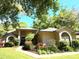 Beautiful home with mature landscaping and a well-maintained lawn, nestled in a serene neighborhood at 1226 Deer Lake Cir, Apopka, FL 32712