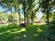 Attractive home featuring a spacious lawn and mature trees, offering serene curb appeal at 1226 Deer Lake Cir, Apopka, FL 32712