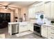 Bright kitchen featuring quartz countertops, stainless steel appliances, and a farmhouse sink at 1226 Deer Lake Cir, Apopka, FL 32712