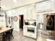 Bright kitchen featuring stainless steel appliances, quartz countertops, and ample cabinet space at 1226 Deer Lake Cir, Apopka, FL 32712