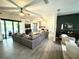 Inviting living area showcasing a large sectional sofa and a view of the outdoor pool area at 1226 Deer Lake Cir, Apopka, FL 32712
