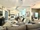 Comfortable living room features a stone fireplace, a large sectional sofa, and open access to the kitchen at 1226 Deer Lake Cir, Apopka, FL 32712