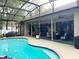 Covered patio overlooking the pool, perfect for outdoor entertaining and relaxation at 1226 Deer Lake Cir, Apopka, FL 32712