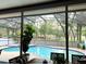 Inviting screened pool area surrounded by lush landscaping offers a private outdoor retreat at 1226 Deer Lake Cir, Apopka, FL 32712