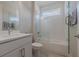 Well-lit bathroom featuring shower over tub, and a sleek vanity with modern fixtures at 1250 Cresswind Blvd, Deland, FL 32724