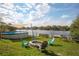 Enjoy the backyard with a fire pit, pool, and lovely lake views, perfect for outdoor relaxation and entertainment at 1258 Russell Dr, Ocoee, FL 34761