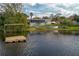 Home backyard with lake access, and dock at 1258 Russell Dr, Ocoee, FL 34761